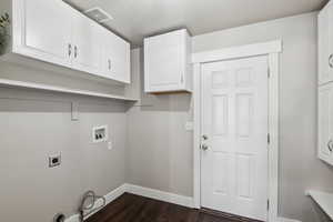 Laundry room featuring washer hookup, dark wood-type flooring, cabinets, and hookup for an electric dryer