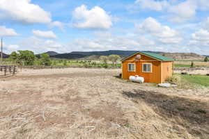View of yard with a mountain view and a rural view