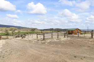 View of yard featuring a view of rural / pastoral area and a mountain view