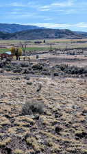 View of mountain background featuring rural landscape
