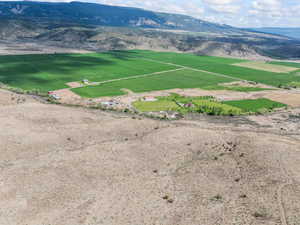 View of mountain backdrop with rural landscape