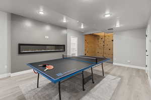 Recreation room featuring light hardwood / wood-style flooring