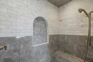 Bathroom featuring tiled shower