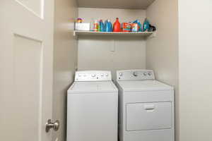 Washroom featuring separate washer and dryer