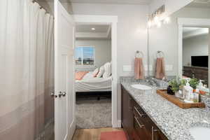 Bathroom featuring vanity and hardwood / wood-style floors