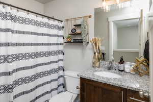 Bathroom featuring toilet and vanity