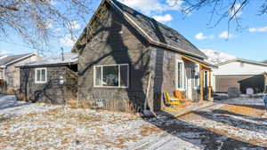 Exterior space with a garage and an outbuilding