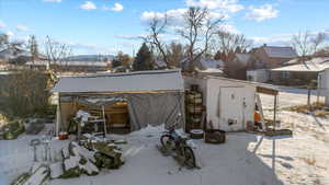 Snow covered structure featuring a mountain view