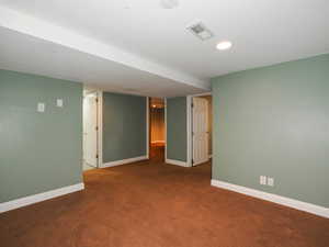 Unfurnished room with carpet floors