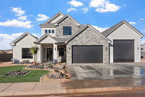 View of front facade with a garage and a front yard