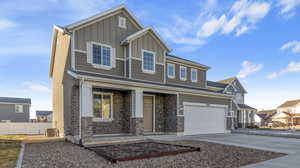 View of front facade featuring a garage