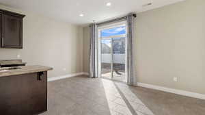 Unfurnished dining area featuring light tile patterned floors