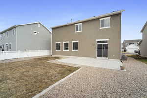 Back of house featuring cooling unit and a patio