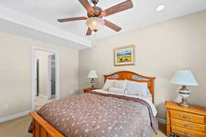 Bedroom featuring ceiling fan and light colored carpet