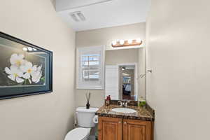 Bathroom with toilet and vanity