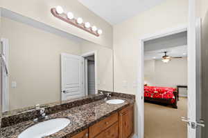 Bathroom featuring ceiling fan and vanity