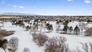 Snowy aerial view with a mountain view