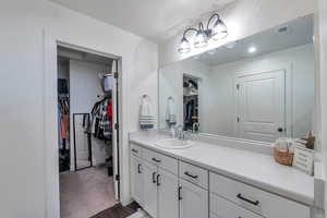 Bathroom with hardwood / wood-style flooring and vanity