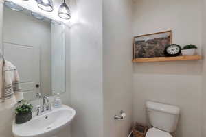 Bathroom featuring sink and toilet