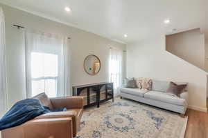 Living room with light hardwood / wood-style flooring