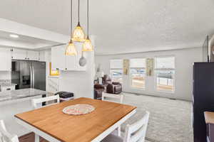 Dining space with a textured ceiling