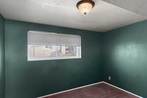 Spare room with a textured ceiling