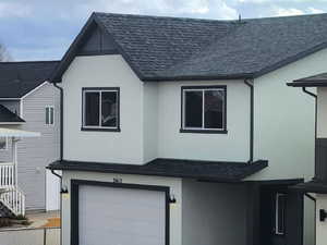 View of front of property with a garage