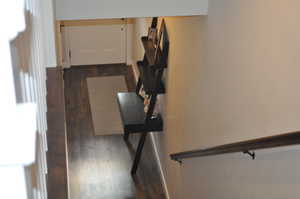 Stairway with hardwood / wood-style flooring