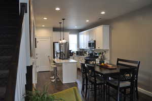 Dining area featuring dark hardwood / wood-style flooring