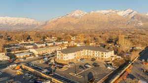 Birds eye view of property featuring a mountain view