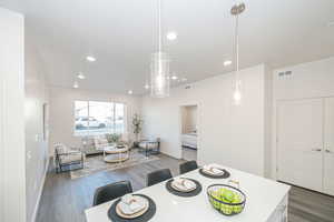 Dining room featuring a textured ceiling and dark wood-type flooring