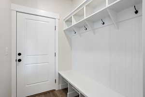 Mudroom with dark hardwood / wood-style floors