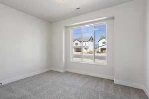 View of carpeted spare room