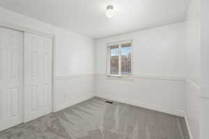 Bedroom number 2 upstairs with  new carpet and new paint