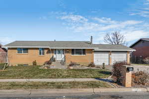 Roy brick home with 2 car garage