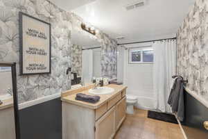 Large basement bathroom with tile in shower.