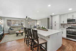 Cabinets have pull out shelves in most of the drawers. Cabinet space on both sides of the island.