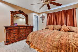 Primary bedroom with ceiling fan