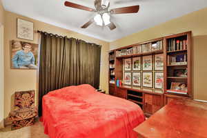 Bedroom with carpet and ceiling fan