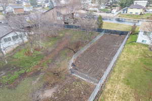 Drone / aerial view featuring large, fenced garden area