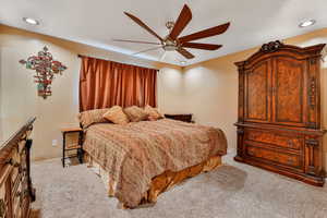 Primary bedroom with ceiling fan