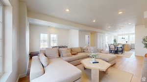 Living room with light wood-type flooring