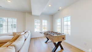 Game room featuring light hardwood / wood-style flooring