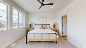 Bedroom featuring ceiling fan and light colored carpet