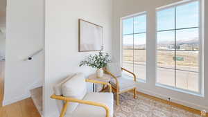 Living area featuring a mountain view and light hardwood / wood-style flooring