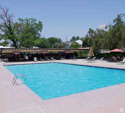 View of swimming pool with a patio