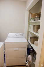 Clothes washing area featuring washer and clothes dryer