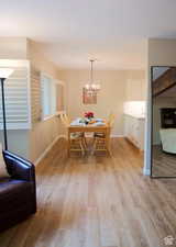 Dining area featuring a chandelier and light hardwood / wood-style floors