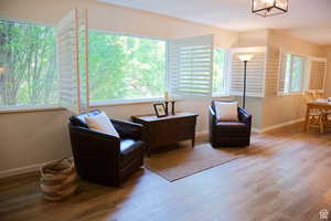 Sitting room featuring a chandelier and hardwood / wood-style floors