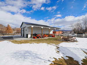 Exterior space with a garage and an outdoor structure